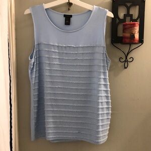 Baby blue sleeveless blouse with decorative front. Has some stretch to it.